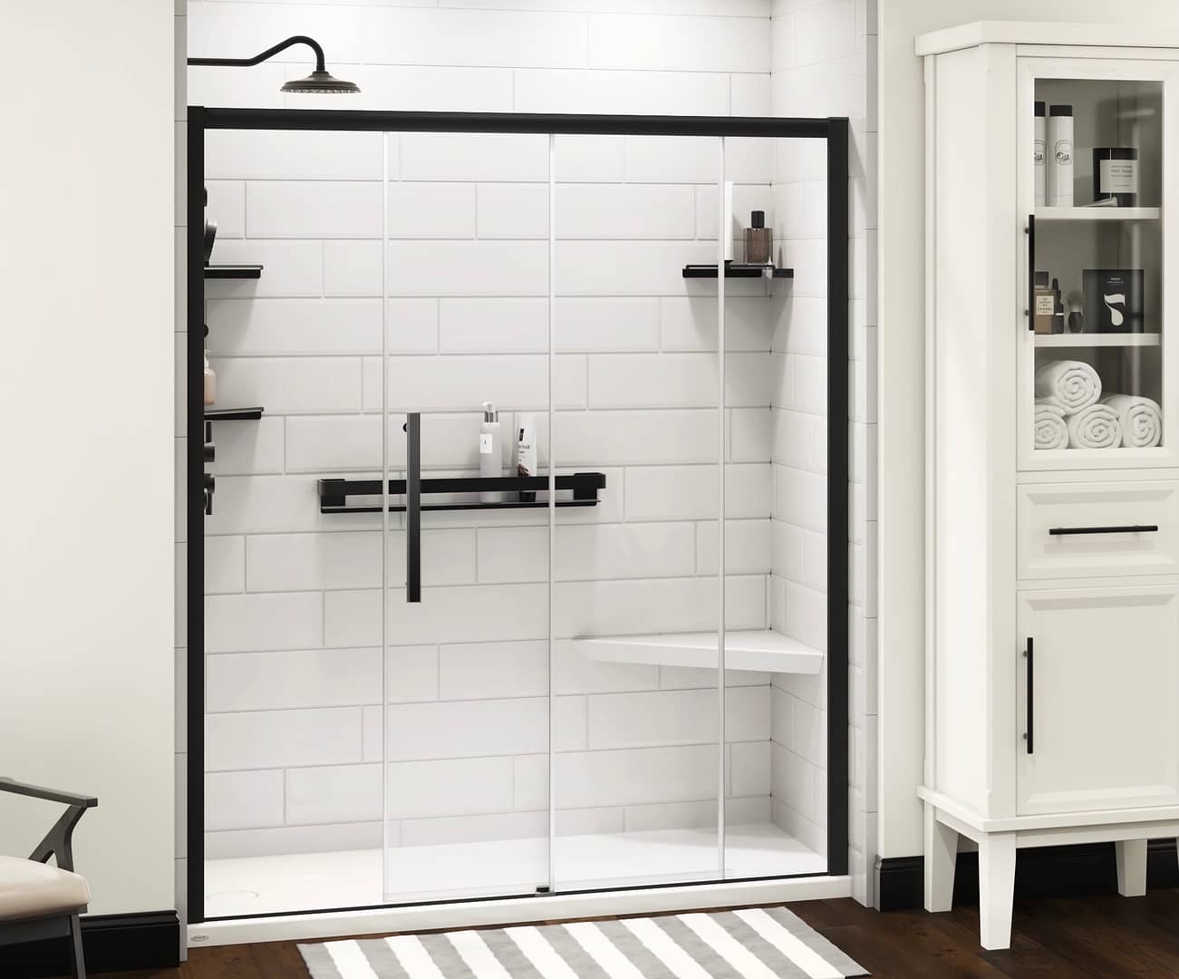 Walk-in shower with a matte black shower fixture and sliding glass doors. Modern, classy white large subway tile walls.